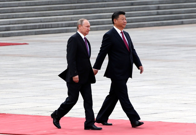  Tổng thống Nga Vladimir Putin và Chủ tịch Trung Quốc Tập Cận Bình tại Bắc Kinh ngày 25/6 (Ảnh: AFP) 