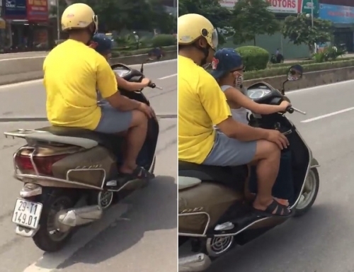 Video: Thót tim cảnh bé trai lái xe máy vi vu giữa phố Hà Nội - Ảnh 1