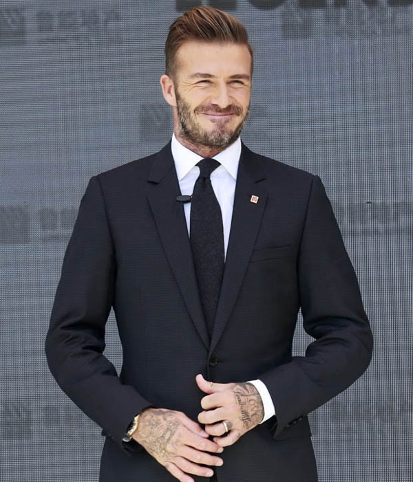 Becks tươi cười khi tới Bắc Kinh hôm 20/9.