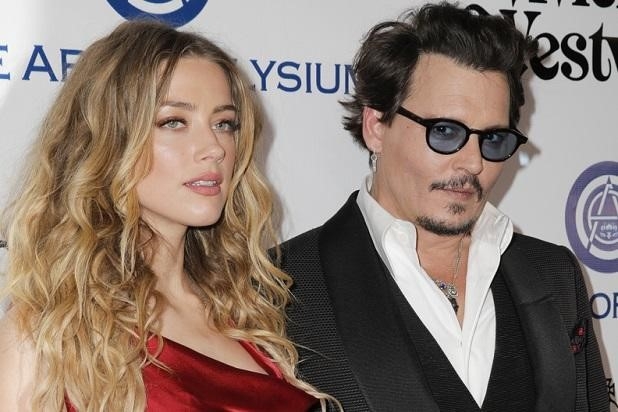 Hau ly hon, Amber Heard nhan 7 trieu USD cung bay thu cung hinh anh 1