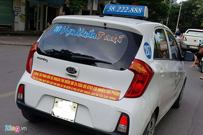 Ha Noi cung yeu cau taxi go bo khau hieu phan doi Uber, Grab hinh anh 1