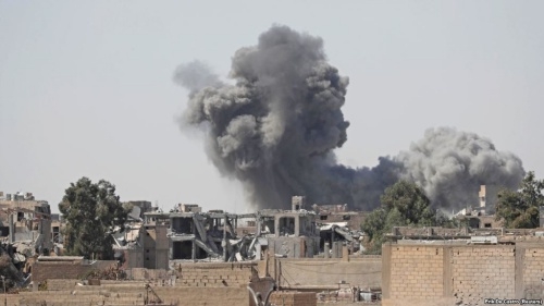 Smoke rises at the positions of Islamic State militants after an air strike by U.S.-led coalition forces at the front line in Raqqa, Syria, on October 5.